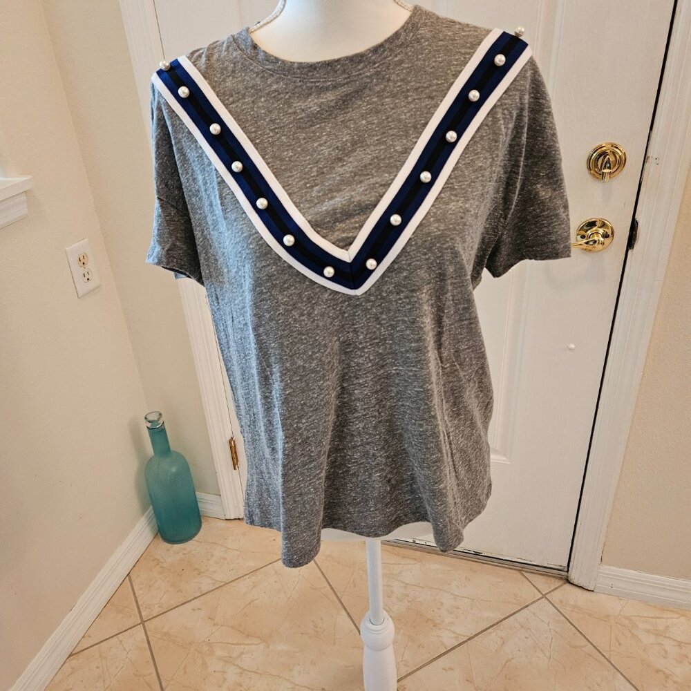 Interesting top.  V on the front with fake (of course) pearls for decoration.